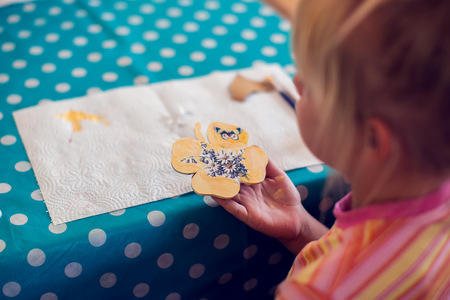 Children hands making artworks with wood and paint crafts. workplace and handcraft Decoupageの写真素材