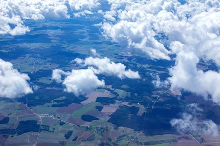 Beautiful view of cumulus clouds with sunny day atmosfera from airplain window