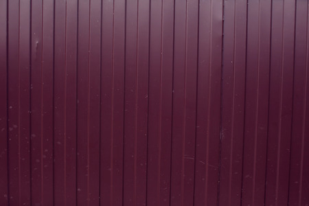 Red color metal sheet material roller gate or door with horizontal lines