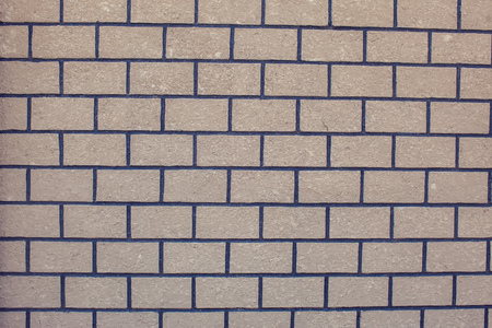 A gray bricks wall background vintage and modern textureの写真素材