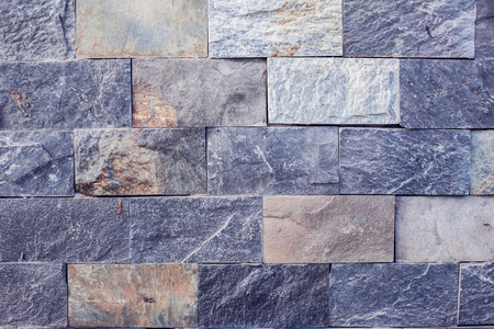 A gray bricks wall background vintage and modern textureの写真素材