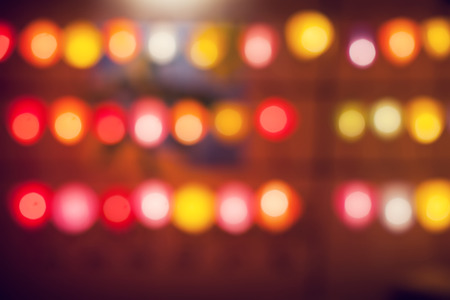 Garlands of lamps of different colors on a wooden backgroundの写真素材