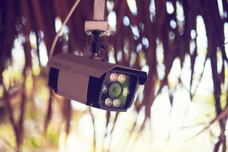 CCTV camera. Security camera on the wall outdoor. Private property protection.