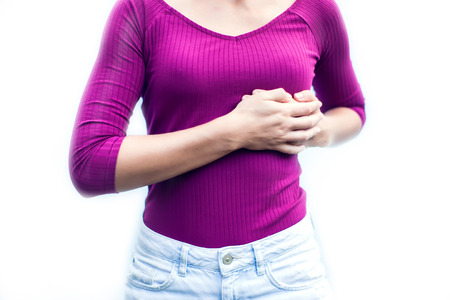 Heart attack concept. Woman suffering from chest pain isolated on white background