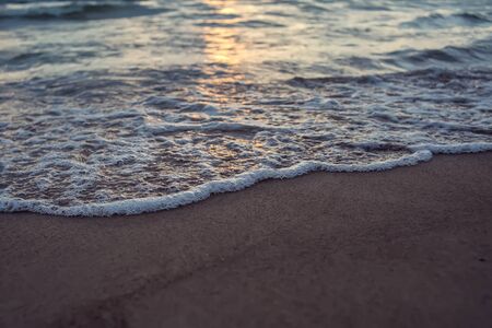 Sea and sky with dark clouds at sunset. Beach in the evening.の写真素材