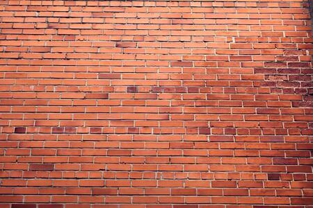 Horizontal red bricks background. A part of wall of the buildingの写真素材