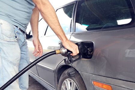 A man refueling car tank with benzin. Car service conceptの写真素材