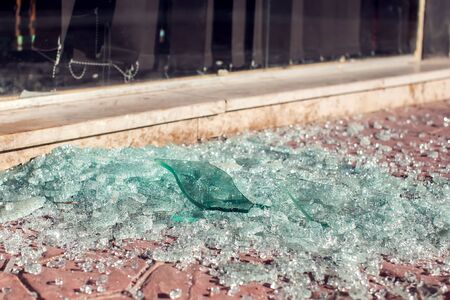 A lot of shards of glass on the ground outdoor