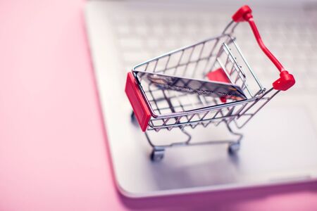 Laptop with shopping trolley. Online shopping and payment conceptの写真素材