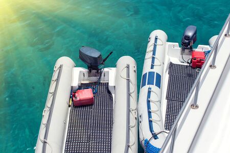 Inflatable boats with motor in the marina.Water transport.