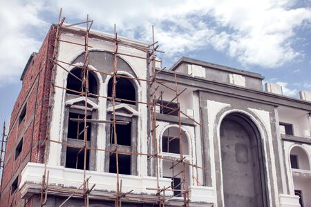 House with wooden scaffolding construction. Architecture and building concept.の写真素材
