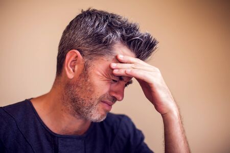 Man feels strong headache isolated. People, healthcare and medicine concept
