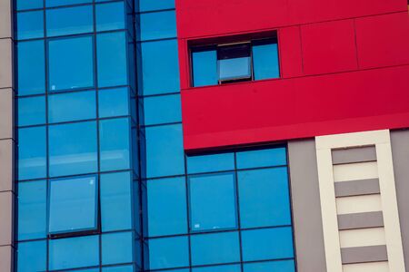 A modern building with glass window background.の写真素材