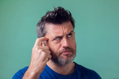 People and emotions - man with beard thinking about something