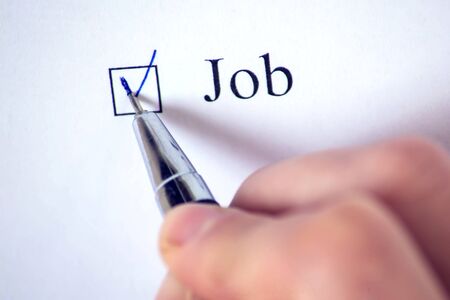 Checklist with a word on white paper with pen. Checkbox concept.の写真素材