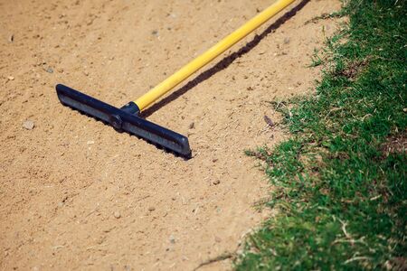 Sand rake equipment on the golf field. Sport and lifestyle conceptの写真素材