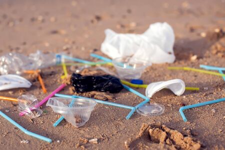 Different Garbage on the beach. Environmental pollution concept