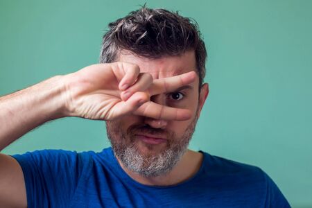 People and emotions - man with kind face and funne poseの写真素材