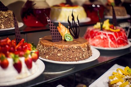 Dessert Sweets on banquet table. Rows of tasty looking desserts in beautiful arrangements hotel Hurghada, Egyptの写真素材