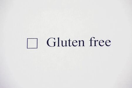 Checklist box with words gluten free on white paper. Check form and healthcare conceptの写真素材