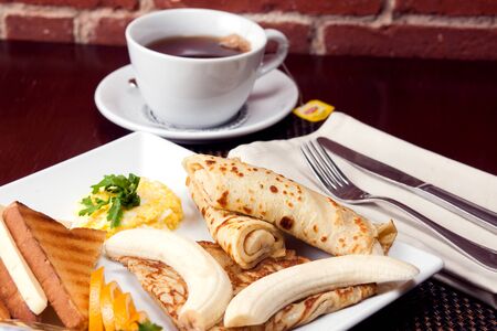 Healthy Full American Breakfast with Pancakes, Banana and toasts with butter.の写真素材