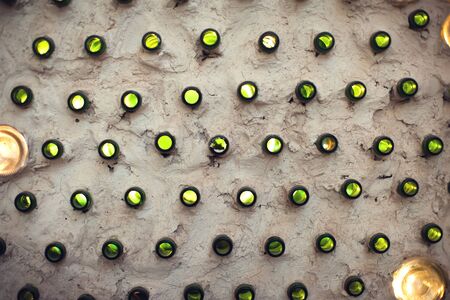 Glass bottles inside the wall background abstract texture