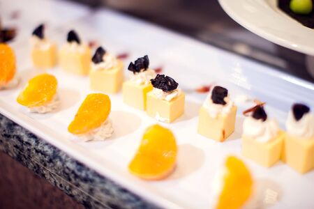 Dessert Sweets on banquet table. Rows of tasty looking desserts in beautiful arrangements hotel Hurghada, Egyptの写真素材
