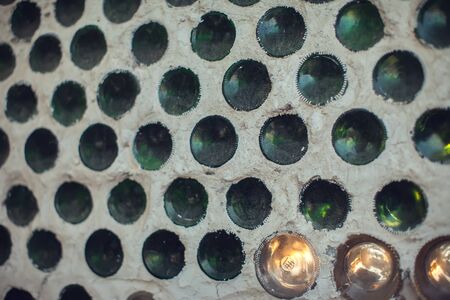 Glass bottles inside the wall background abstract textureの写真素材