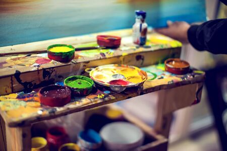 Items for drawing and art: watercolor paint, brushesの写真素材