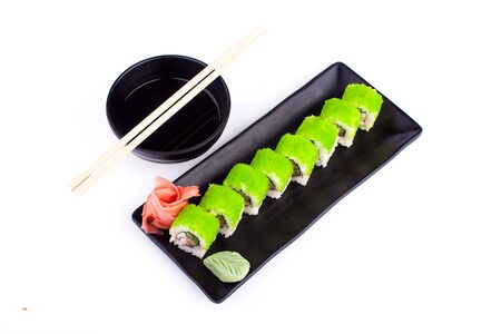 Sushi roll on black plate - japanese food style isolated on white backgroundの写真素材