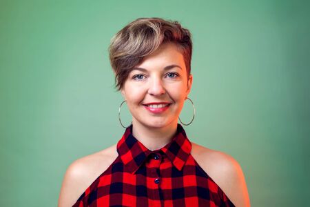 People and emotions - smiling young woman with short dark hairの写真素材