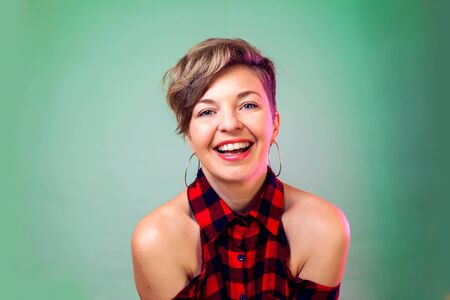 People and emotions - a portrait of happy young woman with short hair