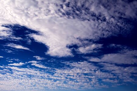 Blue sky background with a tiny cloudsの写真素材