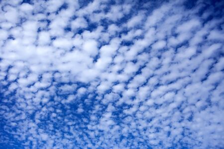 Blue sky background with a tiny cloudsの写真素材