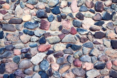 Natural colorful pebbles background on beach in summer for wall design and natural background concept in summer.の写真素材