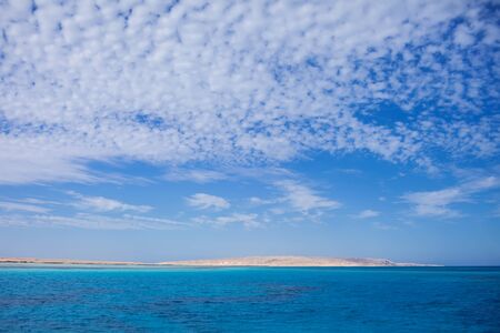 Calm Sea and Blue Sky Background.