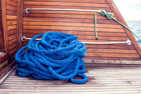 Blue rope on a ship on a wooden table.の写真素材