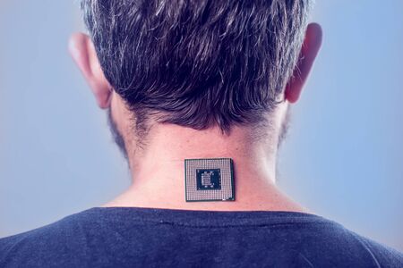 Bionic microchip (processor) implant in male human body - future technology and cybernetics concept