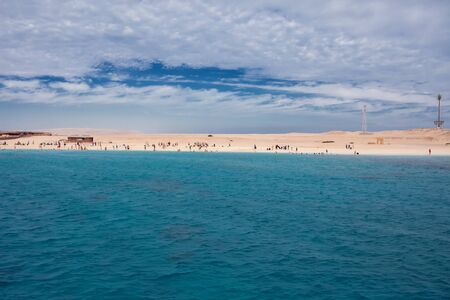 Mahmya island in red sea, Egypt, blue water, sky with clouds and boats