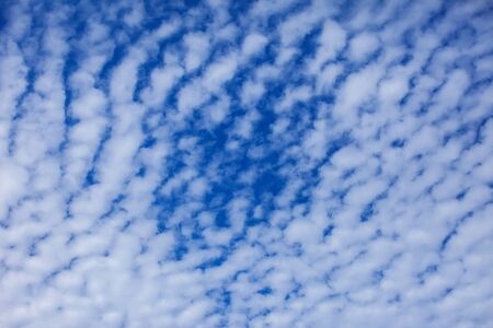 Blue sky background with a tiny cloudsの写真素材