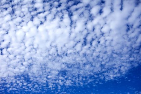 Blue sky background with a tiny cloudsの写真素材