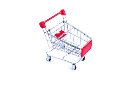 Empty used shopping trolley isolated on white backgroundの写真素材