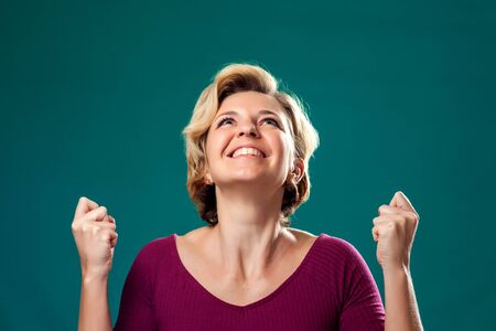 Happy woman with short blond hair fight for head. People and emotions concept