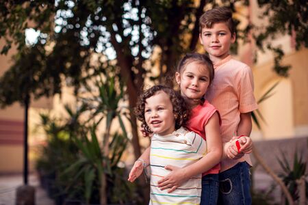 A portrait of happy children boys and girl. Childhood, family and frendship conceptの写真素材