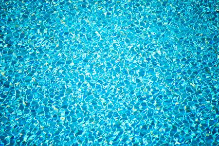 Blue surface of water in swimming pool. Aqua backgroundの写真素材