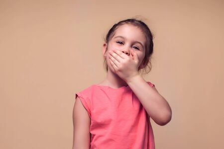 A portrait of tired yawning kid girl. Children and emotions conceptの写真素材