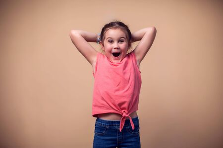 A portrait of happy cute kid girl. Children and emotions concept.