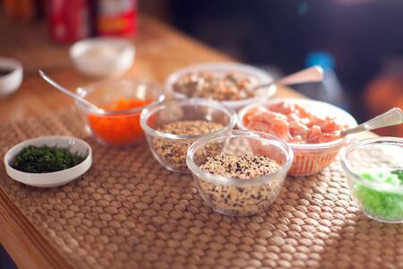 Different kind of seasame seeds and sauces fof sushi on the tableの写真素材