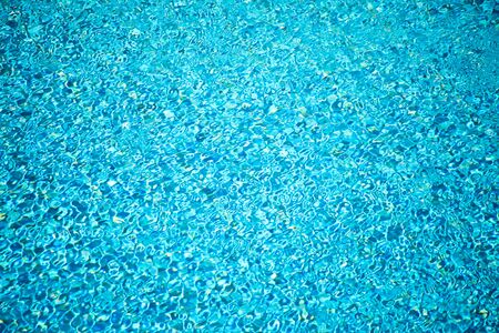 Blue surface of water in swimming pool. Aqua backgroundの写真素材
