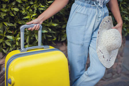 Woman with luggage outdoor. Travel, holiday and lifestyle conceptの写真素材